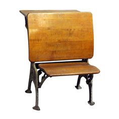 an old wooden school chair sitting on top of a white background with no people around it