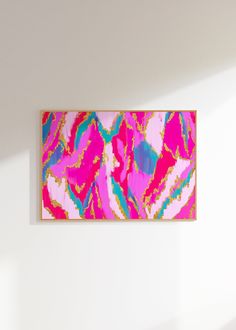 an abstract painting hangs on the wall