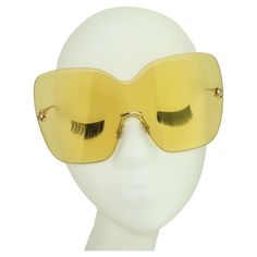 Sporty & chic! Fabulous contemporary Jimmy Choo 'Zelma' wraparound yellow sunglasses designed with a stylistic nod to the mod 1960's. The gold tone frame is light as air and the rimless yellow lenses, with 100% UV protection, are the perfect aid for cutting glare and protecting your pretty peepers. The large size creates a stylized silhouette that will be right at home while poolside or when tooling around town. Fun in the sun! Made in Italy. PLEASE NOTE... These Jimmy Choo's even have a special Wraparound Sunglasses, Sunglasses Yellow, Vintage Haute Couture, Haute Couture Vintage, Trace Adkins, Yellow Sunglasses, Susan Sarandon, The Mod, Vintage Couture