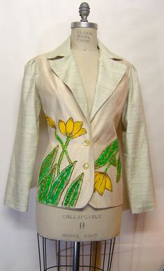 "Hand Made, hand beaded, and hand painted women's blazer, measurements are: Bust, 35; waist, 26; hip, 36; jacket length is 26\" long. Puff sleeve, 24\" long.  Hand made by the designer.  2 buttons in front, one of a kind garment but I can make different sizes to order.  Fully lined inside. Dry clean only." Spring Tailored Embroidered Blazer, Spring Tailored Blazer With Embroidery, Spring Embroidered Tailored Blazer, Spring Embroidered Fitted Blazer, Fitted Silk Blazer For Spring, Spring Silk Fitted Blazer, Fitted Embroidered Blazer For Workwear, Embroidered Fitted Blazer For Workwear, Spring Silk Fitted Outerwear