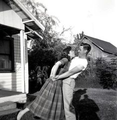 a man and woman standing in front of a house with the caption mom, how many dads do i have?