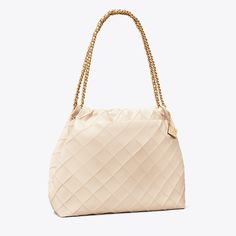 Enduring glamour. The Fleming Soft Hobo Bag is made of the softest leather with diamond pattern pintucks and a braided chain strap. Crafted in partnership with a Leather Working Group-certified tannery, supporting high standards in leather manufacturing and chemical management. Tory Burch Fleming Bag, Soft Leather Hobo Bag, Bag Wishlist, Tory Burch Fleming, Contemporary Accessories, Womens Designer Handbags, Barrel Bag, Soft Autumn, Hobo Bags