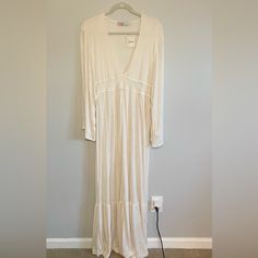 Free People Beach Dress Color Is Cream With Heathered Texture Never Worn With Tags Size Small 65% Polyester 35% Rayon Runs Long Deep V Neck Wide Sleeves Very Boho Chic! Spring V-neck Beach Dress, Cream Long Sleeve Beach Cover-up Dress, White V-neck Maxi Dress For Loungewear, Flowy Cream Maxi Dress For Vacation, Chic V-neck Beach Dress For Loungewear, Cream Long Sleeve Midi Dress For Beach, Chic White Maxi Dress For Loungewear, Cream Long Sleeve Midi Beach Dress, Long Sleeve Cream Midi Dress For Beach