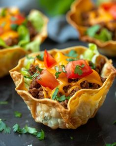 some taco cups are sitting on a table