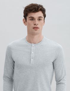 Our long sleeve three-button henley is unmistakably refined, yet subtle. It is destined to be an invaluable addition to your wardrobe given its versatility. Extremely soft, lightweight and elegantly fitted, making it a perfect option for layering or wearing it on its own.

Crafted from our premium lightweight jersey fabric — superfine two-fold (80/2) yarn made from the finest extra long staple Peruvian Pima cotton. Detailed with Mother of Pearl håndværk buttons.

We recommend that you take your Spring Button-up Henley, Spring Button-up Henley With Buttons, Fall Layering Henley With Buttons, Classic Crew Neck Henley With Button Closure, Classic Henley With Button Closure, Gray Long Sleeve Tops With Button Closure, Classic Cotton Henley For Spring, Classic Tops With Buttons For Layering, Classic Crew Neck Henley With Buttons