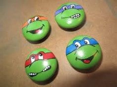 four teenaged turtles painted on wooden buttons