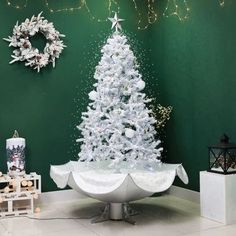 a white christmas tree sitting on top of a table