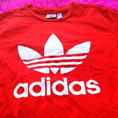 Red Adidas Tshirt New Without Tags Trendy Red T-shirt For Streetwear, University Red Logo Print Crew Neck Top, University Red Crew Neck Top With Logo, Trendy Red T-shirt With Logo Print, Casual University Red Tops, University Red Tops With Logo For Streetwear, University Red Crew Neck Top For Streetwear, University Red Crew Neck Top For Summer, Red Letter Print Tops For Streetwear