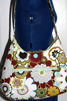 This purse is adorable and very functional but elegant and affordable. Its has floral design fabric with a very cute bow. Its has one big pocket for the inside but a zipper pocket for holding the keys phone or money that something that you want for quickly find. Its has a floral cotton exterior fabric wit ha matching light green interior, with a mint green zipper and a magnetic clasp. Hope you love this purse just as much as I do. In my store in the Wallet/ Purses and keychain section I have the Everyday Floral Print Shoulder Bag With Double Handle, Floral Print Double Handle Shoulder Bag For Everyday, Everyday Floral Print Double Handle Shoulder Bag, Floral Print Tote Shoulder Bag, Floral Print Tote Shoulder Bag For Everyday, Everyday Floral Print Tote Shoulder Bag, Floral Print Double Handle Shoulder Bag For Daily Use, Daily Use Double Handle Shoulder Bag With Floral Print, Daily Use Floral Print Shoulder Bag With Double Handle