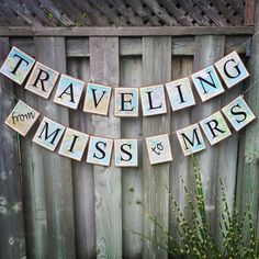 a wooden sign that says traveling from miss and mr's hanging on a fence