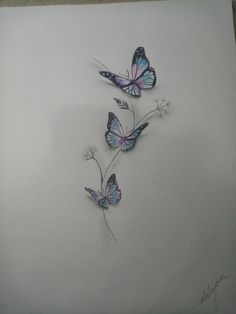 three butterflies flying in the air on a sheet of paper