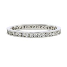 a white gold wedding band with round cut diamonds