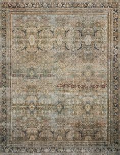 an antique rug with many different colors and patterns on the carpet, it is very nice to