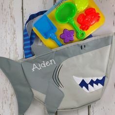 "The only thing your toddler will find more exciting than a trip to the beach, lake, pool, or even a day at the park is when they can carry all their own seaside accessories in a Stephen Joseph Beach Tote. It's already packed with things to play with - five exciting tools for building the perfect sandcastles. Your child will be so happy digging, sifting and making shapes in the sand, Mom might even get a chance to sunbathe in peace. I've added the link at the bottom of the description if you wan Playful Summer School Bags, Fun Summer School Bags, Cute Blue Bags For Vacation, Fun Beach Bag For Beach Season Travel, Fun White Beach Bag, Fun White Beach Bags, Fun Beach Bag For Beach Season, Playful Summer Beach Bag For Travel, Playful Rectangular Beach Bag For Summer