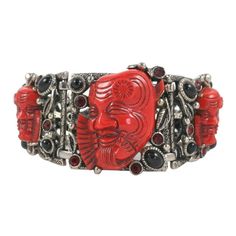 Intricately embellished bracelet with three red synthetic faces, black cabochons, and red rhinestones. 7 1/4" long. Japanese Theater, Aztec Bracelet, Georg Jensen Silver, Noh Mask, Retro Bracelet, Silver Link Bracelet, Red Devil, Brown Jewelry, Cabochon Jewelry