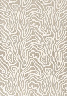 a beige and white rug with wavy lines on it