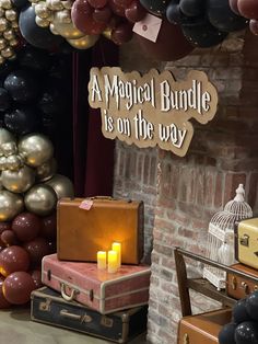 there are many suitcases and boxes on the floor in front of a brick wall with a sign that says a magic bundle is on the way