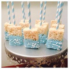 some rice krispy treats with blue and white candles