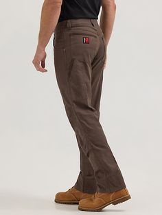 WORKWEAR WARDROBE STAPLE A style that works as hard as you do, our Wrangler® RIGGS WORKWEAR® Utility pants are designed to stand up to any job that comes their way. The durable yet lightweight pants feature reinforced front panels and a cotton blend construction with the right amount of stretch to keep you moving comfortably. Function-first pockets, including a large utility side pocket and reinforced, Cordura-lined back pockets, provide plenty of storage options for small tools and other on-the Fitted Brown Work Pants With Pockets, Brown Work Pants With Side Pockets, Brown Work Pants With Hip Pockets, Brown Full Length Work Pants With Belt Loops, Brown Utility Work Pants With Belt Loops, Workwear Fashion Men, Construction Pants, Workwear Wardrobe, Wrangler Pants