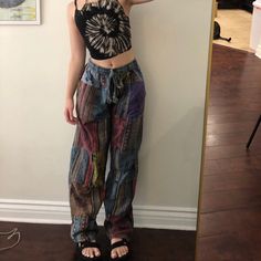 Beautiful boho patchwork hippie pants! Has colorful patchwork and stamps all over, waist goes to 30' and ties to fit any waist size smaller! Very comfy, I'm 5'2 for reference  *coloring will vary slightly pair to pair Hippie Work Outfit, Edgy Hippie Style, Earthy Grunge Outfits, Simple Hippie Outfits, Modern Hippie Outfits, Dark Hippie Outfits, Goth Hippie Outfits, Casual Hippie Outfits, Hippie Inspired Outfits