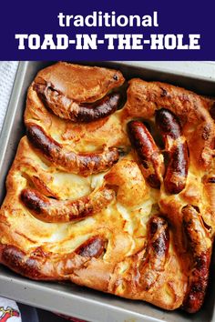 there is a square casserole with sausages on it and the words traditional toad - in - the - hole