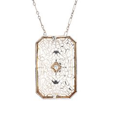 Finely detailed vintage Art Deco drop necklace (circa 1920s to 1930s), crafted in 14 karat white gold.   The drop is set with an estimated 0.04 carat Old European cut diamond (estimated at H-I colour and SI1 clarity).    The die-struck necklace features intricate and lacy filigree detail. The chain is comprised of longer bar links attached to smaller round links. The necklace measures 17 inches and sits nicely at the nape of the neck. The filigree necklace was very popular during the era and is Antique White Gold Diamond Necklace With Accents, Vintage White Gold Diamond Necklace With Single Cut Diamonds, Antique White Gold Diamond Necklace With Single Cut Diamonds, Formal Hallmarked Necklace With Rectangular Pendant, Formal Engraved Diamond Pendant Necklace, Gold Diamond Cut Platinum Necklace, Art Deco White Gold Necklace For Evening, Platinum Gold Diamond Cut Necklace, Gold Platinum Necklace With Diamond Cut