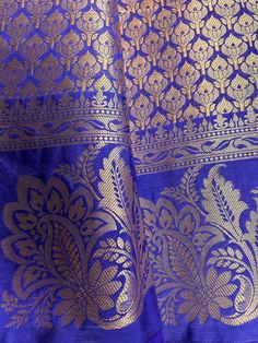 Gorgeous Statement designer Saree in Royal Blue color with Muted Gold Zari Weaving. Saree has Floral Motifs all over with design pattern borders with big flower buttas. Item : SareeColor : Royal Blue Base Fabric : Banarasi Silk Blouse material : Soft Banarasi Silk Work : Handloom Blue Anarkali Set With Traditional Drape And Pallu, Blue Chanderi Anarkali Set With Pallu, Eid Royal Blue Cutdana Dupatta, Blue Anarkali Set With Pallu In Raw Silk, Blue Art Silk Anarkali Set With Pallu, Royal Blue Festive Kurta With Pallu, Festive Royal Blue Kurta With Pallu, Royal Blue Zari Work Saree For Festive Occasions, Blue Art Silk Salwar Kameez With Cutdana