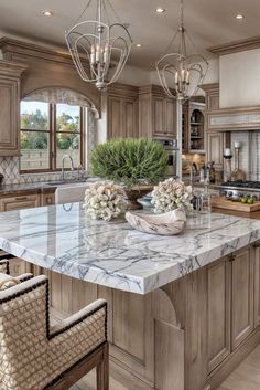 a large kitchen with marble counter tops and wooden cabinets