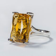 🌟 Citrine Meaning and Healing Powers: Material: Crafted from solid silver with a purity of 950, showcasing our JR950MX hallmark for authenticity and quality. 🏷️ Finish: Natural silver color with a mirror finish for a radiant appearance. ✨ Gemstone: Madeira citrine, 14mm x 18mm, faceted cut in emerald shape, known for its exceptional color play and vibrant bicolor hues. 💎 Design: Unique cathedral minimalist design tailored for those with discerning tastes. 🏛️ Techniques: Created with traditio Modern Citrine Jewelry With Polished Finish, Fine Jewelry White Gold Citrine Topaz Ring, Modern White Gold Jewelry With Citrine, Modern White Gold Citrine Jewelry, Classic White Gold Citrine Jewelry, Citrine Jewelry With Polished Finish For Anniversary, Modern Citrine Jewelry For Anniversary, Anniversary Citrine Jewelry With Polished Finish, Sterling Silver Yellow Gold Topaz Ring With Polished Finish