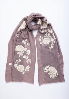 Add a touch of elegance to your wardrobe with our copper cashmere scarf, featuring bold floral embroidery in striking two-tone beige and ivory. The rich copper hue beautifully complements the intricate floral design, making it a standout accessory. Crafted from luxuriously soft cashmere, this scarf provides warmth and comfort, while the delicate eyelash fringes add a refined, textured finish. Whether styled casually or for a special occasion, this exquisite piece effortlessly enhances any outfit Elegant Embroidered Beige Pashmina Shawl, Cream Embroidered Pashmina Scarf, Elegant Beige Embroidered Pashmina Shawl, Elegant Beige Pashmina Shawl With Intricate Embroidery, Elegant Beige Shawl With Resham Embroidery, Beige Embroidered Pashmina Scarf, Elegant Beige Scarves For Festive Season, Elegant Beige Festive Scarves, Elegant Beige Shawl With Intricate Embroidery