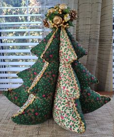 a christmas tree made out of fabric on top of a table