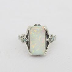 Vintage Sterling Silver White Opal Ring....Marked 925...Total of weights 4.4grams... Size 10...Measure of Face 16.2MM...It's in very good condition. Antique White Multi-stone Rings, Vintage Silver Multi-stone Opal Ring, Classic Silver Opal Ring With Multi-stone, White Gold Opal Ring Stamped 925 For Formal Occasions, Silver Opal Ring For Collectors, Ethiopian Opal Engagement Ring, Opal Stone Ring, Opal Band Ring, Vintage Opal Engagement Ring