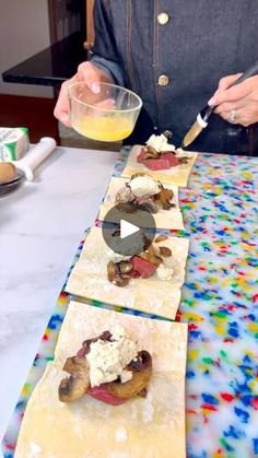 a person preparing food on top of paper towels