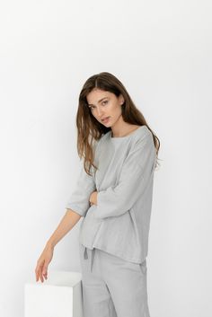 "When ordering you can choose to have the \"PANTS\" or \"TOP\" only or the whole \"PAJAMA SET\" of both items. When buying a set you save 5 euro. Comfortable relaxed fit EVA pajama pants in ice grey with pockets and fabric strap. Oversized CHLOE top in ice grey TOP: - length is ± 64 cm (25\") (depends on size) - wide mid-length sleeves - boxy fit BOTTOM: - outseam is ± 98 cm (38.5\") (depends on size) - inseam is ± 70 cm (27.5\") - elastic waistband with fabric strap - two side pockets DETAILS: Spring Sleepwear Sets In Relaxed Fit, Spring Sleepwear Sets With Relaxed Fit, Spring Season Relaxed Fit Sleep Sets, Summer Loungewear Tops Half Sleeve, Summer Half-sleeve Loungewear Tops, Summer Half-sleeve Tops For Loungewear, Half Sleeve Tops For Summer Loungewear, Summer Half Sleeve Tops For Loungewear, Relaxed Fit Sets For Spring