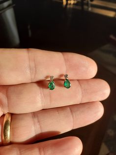 This is a new, never worn pair of 6x4mm  14kt White Gold Emerald Earrings with diamond accents.   These are 6x4mm quality hand picked Colombian Emeralds and 1.5mm diamond accent stones.  These are natural Emerald gemstones set in solid 14kt white gold settings and come with 14kt solid white gold backs as well.   Thanks Elegant White Gold Diamond Earrings With Emerald, White Gold Emerald Drop Earrings, White Gold Pear-shaped Emerald Jewelry, Classic Pear-shaped Emerald Earrings, Pear-shaped Emerald Earrings Fine Jewelry, Gold Emerald Earrings, Colombian Emeralds, Emerald Earrings, Emerald Gemstone