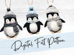 three penguins wearing hats and scarves are hanging from strings with the words digital felt pattern