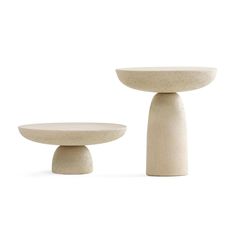 two white pedestals sitting next to each other