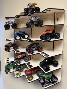 there are many toy trucks on the shelves