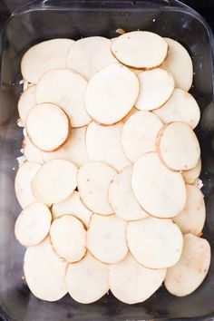 sliced potatoes in a container ready to be cooked