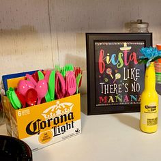 there are many items on the counter in this kitchen that include toothbrushes, lemonade, and soda