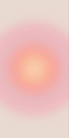 an orange and pink blurry image on a white background