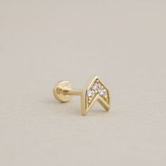 All of our jewelry is handmade per order to make sure you will have the highest quality and our goal is to give you the this value at the lowest price possible. Aim for stylish sophistication with this 14K Gold Arrow Piercing. Designed for tragus or helix piercings, this minimalist arrow stud features a sleek and contemporary design that adds a modern edge to your ear stack. Crafted from solid gold, it offers both durability and elegance, making it a perfect choice for everyday wear or special o Minimalist 14k Gold Jewelry With Prong Setting, Arrow Piercing, Helix Piercings, Gold Arrow, Piercing Tragus, Tragus Piercing, Baguette Ring, Ear Stack, Eternity Band Ring