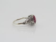 Vintage Sterling Silver Oval cut Ruby Filigree Ring...Marked 925...Total of weights 2.8grams.. Size 9...Measure of Face 10.9mm...It's in very good condition Oval Filigree Promise Ring Hallmarked, Classic Oval Ruby Ring With Filigree, Engraved Oval Filigree Ring For Promise, Engraved Filigree Oval Promise Ring, Engraved Oval Filigree Promise Ring, Ornate Oval Ruby Ring With Filigree, Ornate Oval Filigree Ring Stamped 925, Classic Oval Sterling Silver Filigree Ring, Classic Oval Filigree Ring Stamped 925