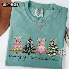 Get into the cozy season with this Christmas tree-themed T-shirt. Made of high-quality, garment-dyed fabric, this tee features a relaxed fit for ultimate comfort. Perfect for anyone looking to embrace the festive spirit during the holiday season. Product features - Available in multiple sizes from S to 4XL - Double-needle stitching for durability - Without side seams for a polished look - Garment-dyed fabric for a soft texture - Made with 100% ring-spun US cotton for comfort Care instructions - Machine wash: cold (max 30C or 90F) - Do not bleach - Tumble dry: low heat - Iron, steam or dry: low heat - Do not dryclean Green Cotton Top For Holidays, Green Cotton Holiday Top, Cotton T-shirt For Fall Holiday, Green Cotton T-shirt For Holiday, Camo Christmas, Christmas Green Cotton T-shirt, Polished Look, Winter Christmas, Comfort Colors