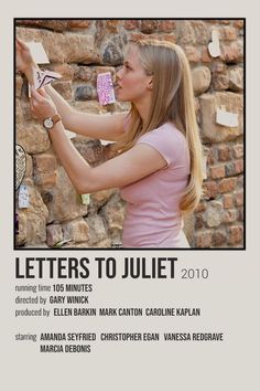 a woman is writing on a wall with post it notes in front of her and the words letters to jujet 2010 written below