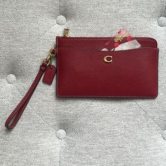 Coach L Zip Wristlet Details: -Polished Pebbled Leather -Brass/Cherry Color -Eight Credit Card Slots -Open Pockets -Detachable Wrist Strap -Zip Compartment -7 3/4" (L) X 4 3/4" (H) -Wristlet, Slim Wallet And Clutch In One -New With Tags And Packaging -Gift Cards / Cards Not Included -Display Items Not Included Thank You For Shopping Purse Vain’s Closet. While You Are Here, Take A Look At Our Other Listings And Bundle Some Of Our Exciting Pieces. Please Message Us With Questions And Ensure Poshma Red Coach Wallet, Preppy Accessories, Bday List, Cherry Color, Polished Pebble, Packaging Gift, 17th Birthday, Coach Wallet, Coach Wristlet