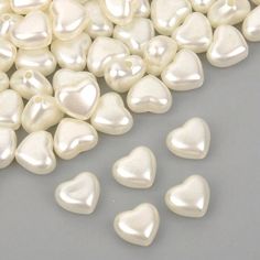 white heart shaped pearls on a gray background