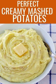 a white bowl filled with mashed potatoes and butter on top of a checkered table cloth