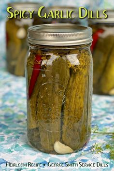 pickled garlic in a jar with the title spicy garlic dills