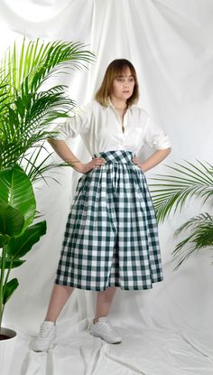 "Forest Green check high waist full gathered skirt. Perfect for casual outfits and special ocasions with pair of trainters or high heels. 100% cotton.  Elastic at the back of waist.  Two side pockets. Midi lenght about 70cm + 5 cm waistband. Handmade in UK.  Model wears size S.  HOW TO CHOOSE A SIZE ?   Using a measuring tape, measure the smallest part of your waist.  SIZE CHART: (CM) XS - W: 66 CM S - W: 70 CM M - W: 74 CM  L - W: 78 CM  XL - W: 82 CM  CARE INSTRUCTIONS: Hand wash only, do not bleach, hang dry, do not tumble dry, press with a cool iron on the reverse side.  Please message me before purchasing so I can check availability. If you wish this skirt in any other fabric, shorter or longer \"send message to seller\" and we can try to make something especially for you. *Depends on Classic Cotton Midi Skirt, Classic Midi Length Cotton Skirt, Fitted Cotton Skirt For Picnic, Plaid Cotton Lined Skirt Bottoms, Plaid Cotton Relaxed Skirt, Spring Gingham Cotton Skirt, Summer Plaid Flared Skirt, Classic Cotton Bottoms With Voluminous Skirt, Classic Cotton Voluminous Skirt